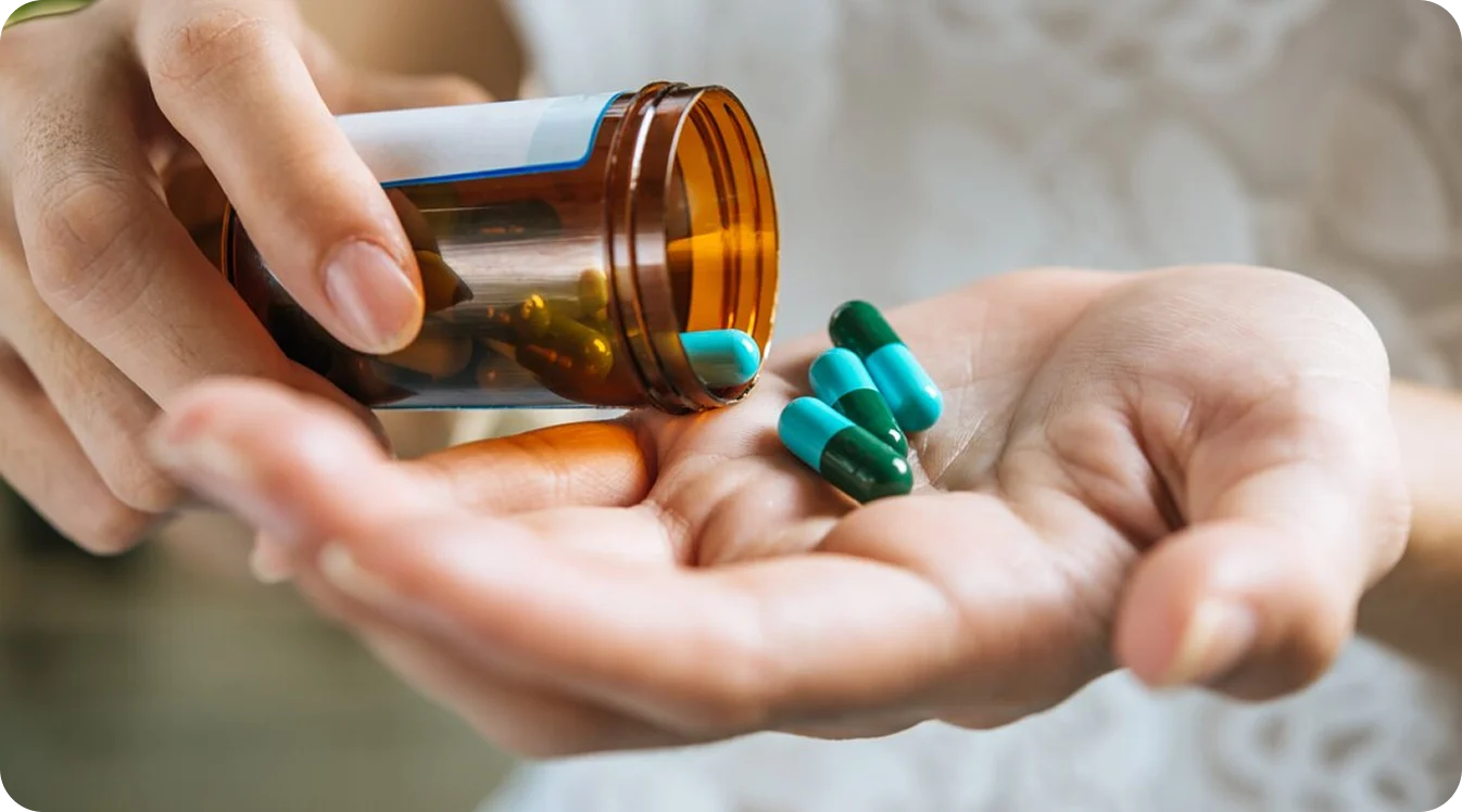 Capsules poured into a hand